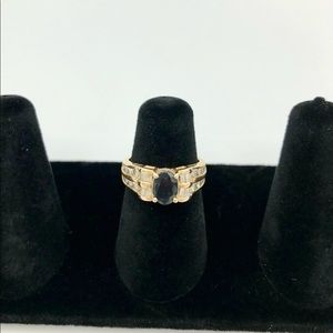14kp gold ring w/ a black gemstone & diamonds